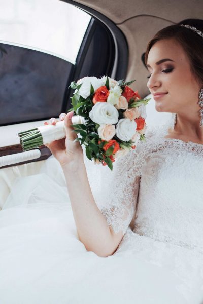 Portrait of a beautiful young bride in the car.